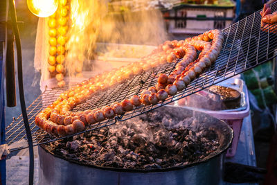 Close-up of meat on barbecue grill