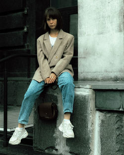 Portrait of teenage girl sitting on seat