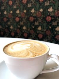 Close-up of cappuccino on table