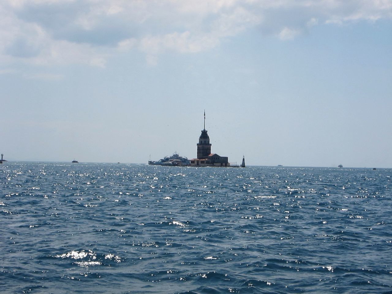 sea, waterfront, water, horizon over water, rippled, sky, tranquil scene, scenics, tranquility, beauty in nature, nature, blue, seascape, built structure, lighthouse, building exterior, nautical vessel, idyllic, day, outdoors