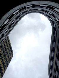 Low angle view of building against cloudy sky