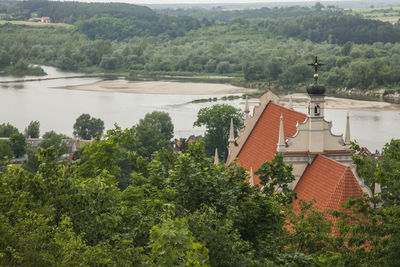 High angle view of trees and buildings against sky