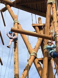 Low angle view of hanging against sky