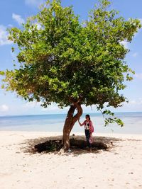 Woman walking on beach