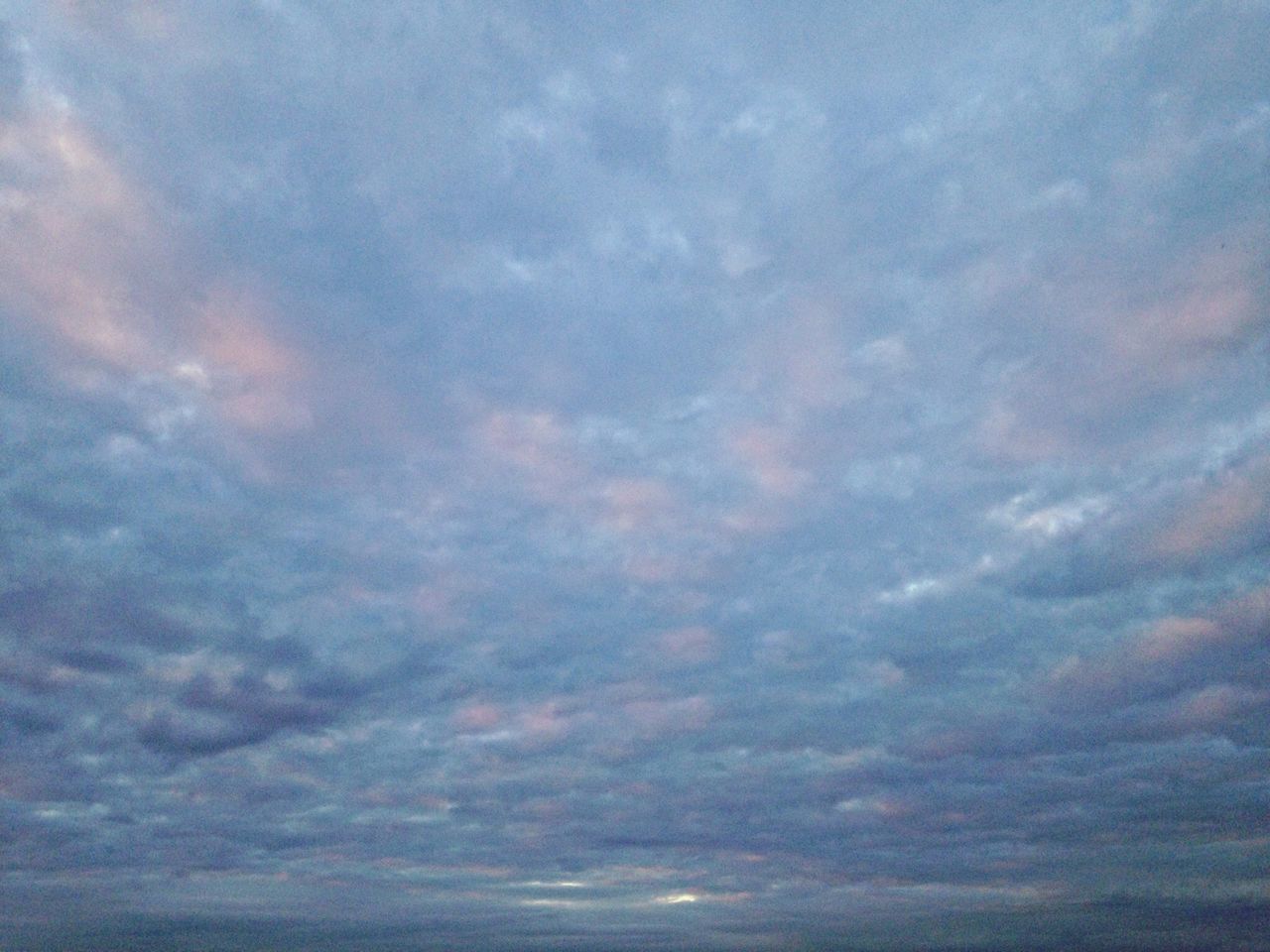 sky, cloud - sky, scenics, beauty in nature, tranquility, tranquil scene, cloudy, cloudscape, nature, idyllic, low angle view, cloud, sunset, weather, overcast, dramatic sky, sky only, outdoors, backgrounds, majestic