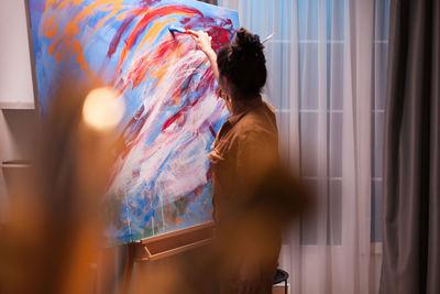 Woman painting at home