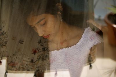 Woman seen through glass