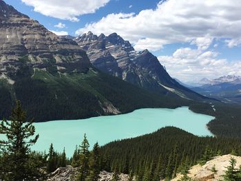 Scenic view of mountains against cloudy sky