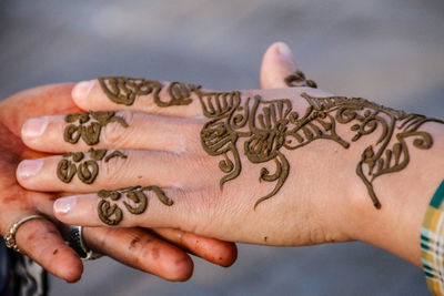Close-up of woman hand with tattoo