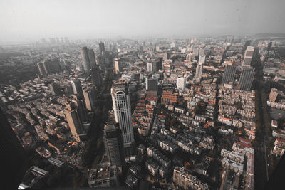 High angle view of modern buildings in city against sky