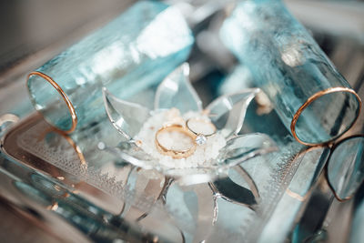 Close-up of wedding rings on table