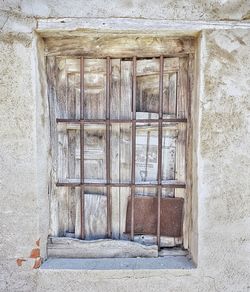 Close-up of window of abandoned building