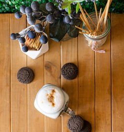 High angle view of cappcappuccino coffee cup on wood table