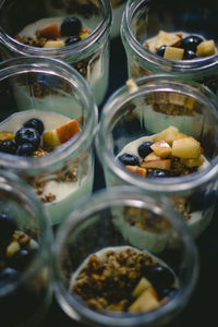 Close-up of food in glass jars on table