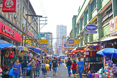 People walking on street in city