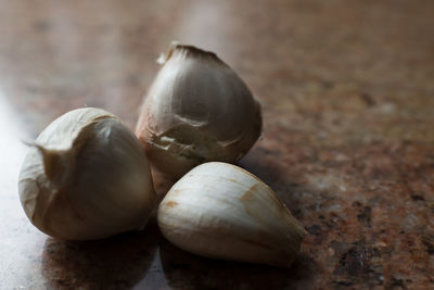 Close-up of garlic on table