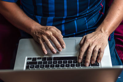 Close-up of a using his laptop in the quarantine period