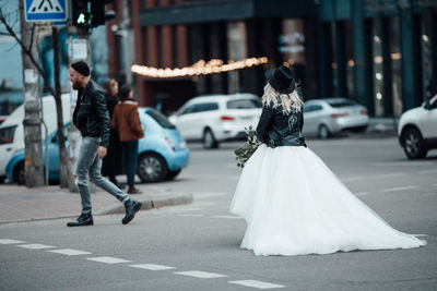 People walking on road in city