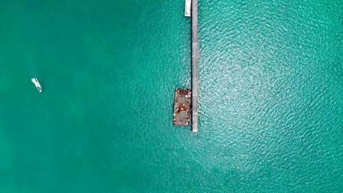 Aerial view of metallic structure on sea
