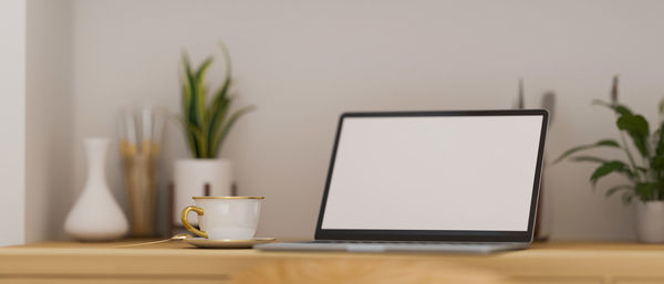 Coffee cup on table at home