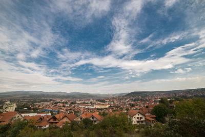 Aerial view of townscape against sky