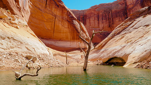 View of rock formations in water