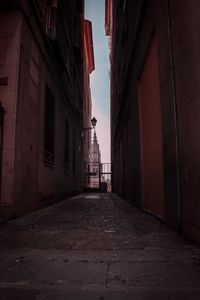 Narrow alley amidst buildings in city