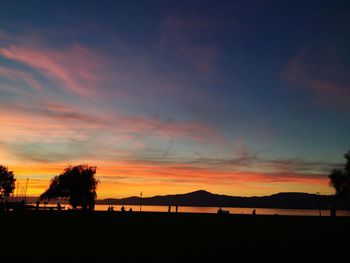 Scenic view of beach against sky during sunset
