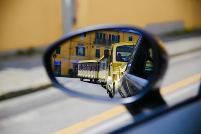 Reflection of car on side-view mirror