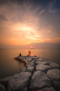 Scenic view of sea against sky during sunset