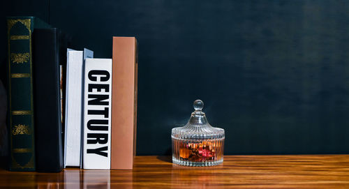 Books on table against wall