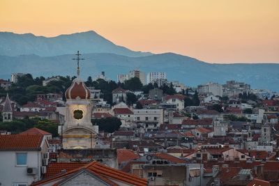 Aerial view of townscape against sky during sunset