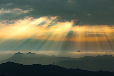 Low angle view of silhouette mountain against sky