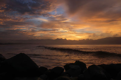 Scenic view of sea against sky during sunset