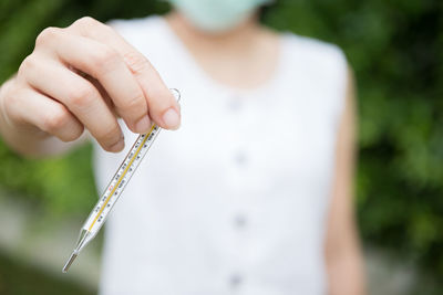 Close-up of woman holding hand