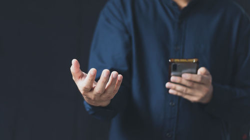 Social media technology concept, men's hands using smartphones to login social media, work from home 