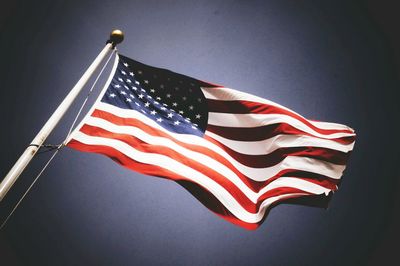 Low angle view of flag against sky