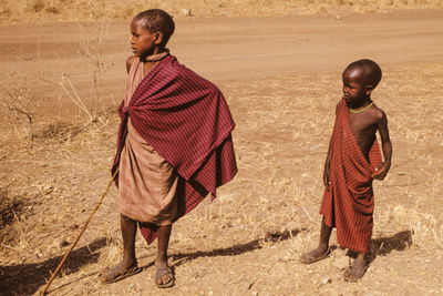 Full length of a boy walking on street