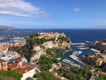High angle view of monaco townscape by sea against sky. mediterranean sea habitation 