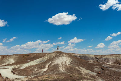 Scenic view of arid landscape against sky