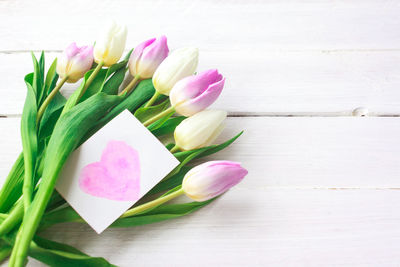 High angle view of pink tulip on table