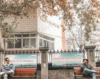 Portrait of man against building in city