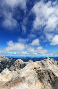 Scenic view of mountains against blue sky