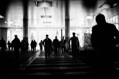 Silhouette people walking in bus