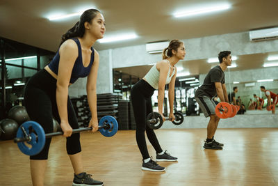 Portrait of woman exercising in gym