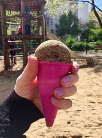 Close-up of hand holding umbrella