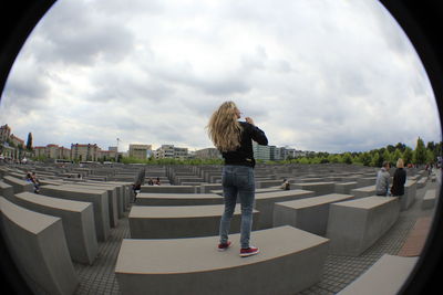 Woman standing at memorial to the murdered jews of europe in city