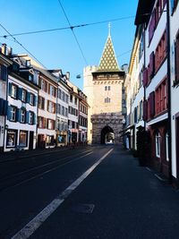 View of road along buildings