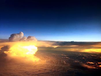 Scenic view of landscape against sky at sunset