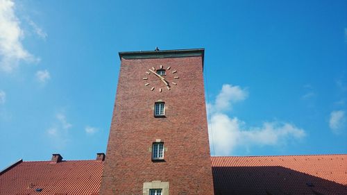 Low angle view of building against blue sky